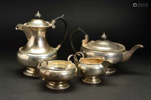 A GEORGE V SILVER FOUR PIECE TEASET, of circular form, comprising teapot, hot water jug, twin