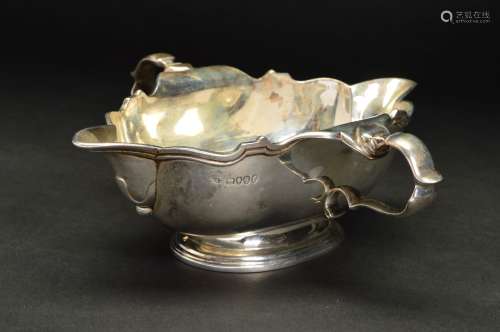 A VICTORIAN SILVER TWIN HANDLED DOUBLE LIPPED SAUCE BOAT, of shaped rectangular form with wavy