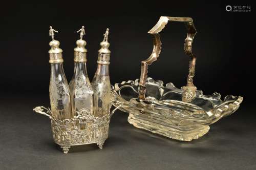A MID 19TH CENTURY DUTCH SILVER MOUNTED GLASS CAKE BASKET, the swing handle with engraved foliate