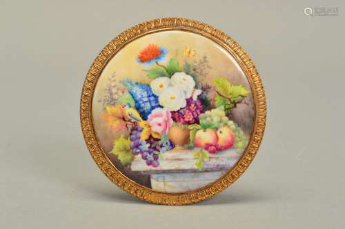 A STEFAN NOWACKI CIRCULAR PORCELAIN PLAQUE, painted with a still life of fruits, flowers, bird and