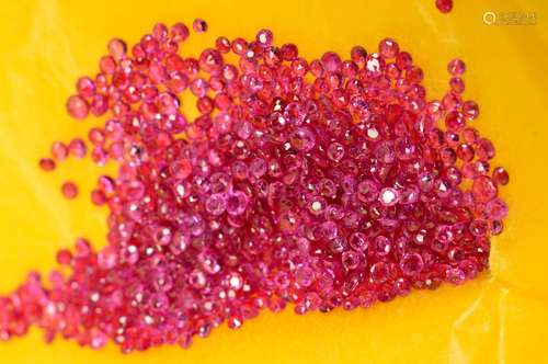 A SELECTION OF SMALL ROUND RUBIES, measuring approximately 1.5mm - 2.5mm in diameter, approximate