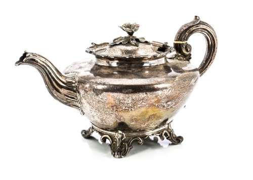 A William IV silver teapot by the Barnards, London 1836, with flower finial, shaped rim on