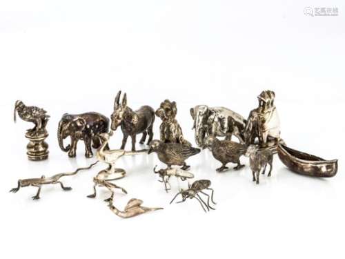 A collection of silver and silver plated small animals and insects, including a snail, lizard,