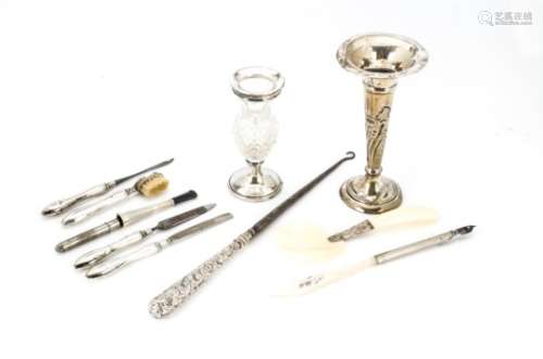 A George V silver part manicure set, together with a mop and silver pen and a spoon, a cut glass and