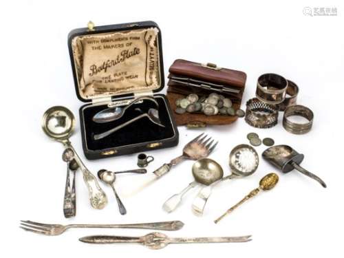 A small collection of silver and silver plate, including a silver napkin ring and gilt spoon, and
