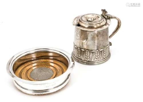 A George V silver mustard tankard, engraved with the Merchant Taylors Company crest, with blue glass