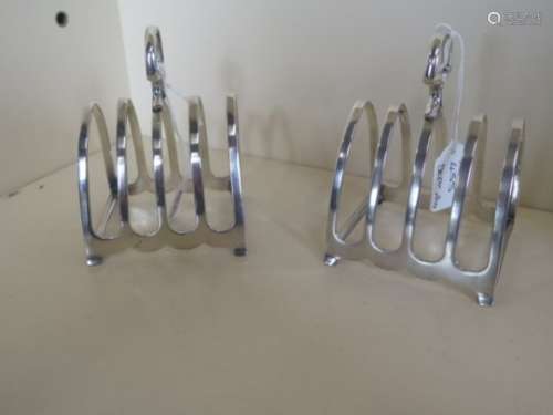 A pair of silver four section toast racks, hallmarked Birmingham 1931 - makers Symer and Beddows,