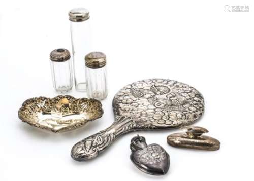 A Victorian silver hand mirror, together with a silver scent bottle holder lacking its bottle, a