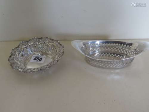 Two hallmarked silver baskets, one with embossed decoration, one pierced, made by Henry Atkin,