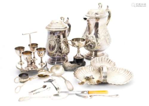 A collection of Victorian and later silver plated items, including a large trophy tankard,