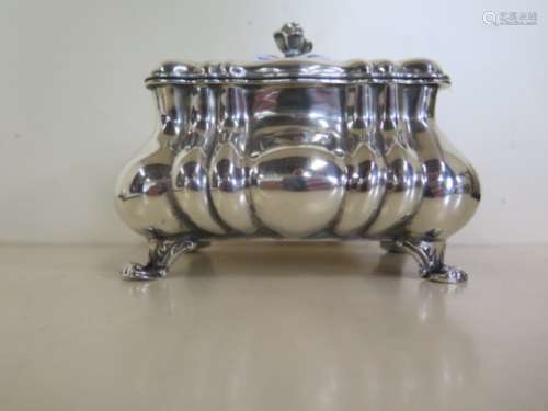 A Continental silver casket with hinged lid, standing on four scroll feet, Austro Hungarian