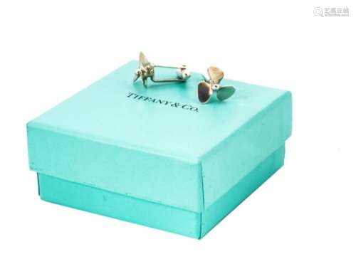 A pair of modern silver cufflinks from Tiffany & Co, with propellers, in box and bag
