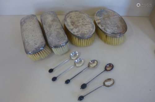 Two pairs of silver back brushes, and five silver coffee spoons