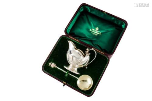 A cased Edward VII silver jug and spoon set by Harry Atkin, the cornucopia style jug and spoon