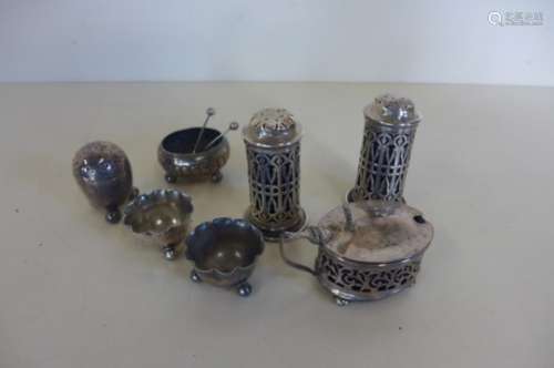 A collection of silver mustards, salts, pepperettes etc, total silver weight approx 5.5 troy oz,