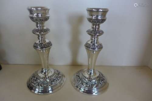 A pair of weighted silver candlesticks, 19cm tall, in good condition