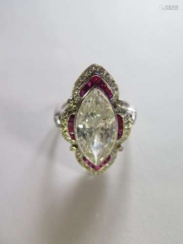 An impressive Art Deco diamond and ruby ring, with a central marquise cut diamond, approx 5ct,