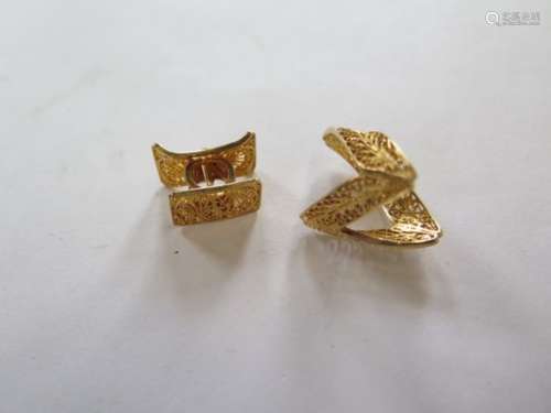 A Ghanaian filigree gold V shape ring, and a pendant in the form of a head rest, both test as 14ct