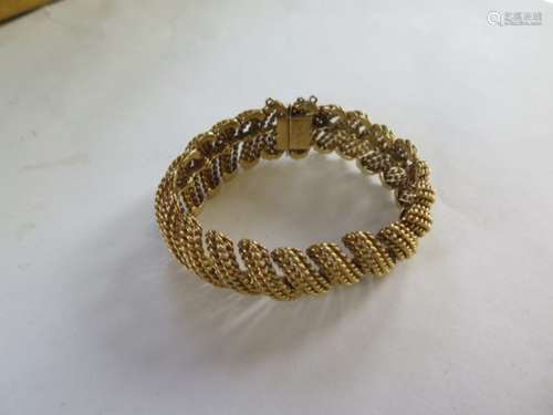 An 18ct gold bracelet with twenty one rope link sections, 18cm long, approx 68.6 grams, missing