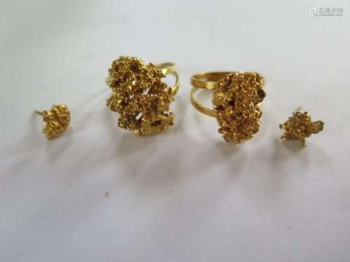 Two gold nugget design rings, and a pair of earrings, total weight approx 21.5 grams, tests to