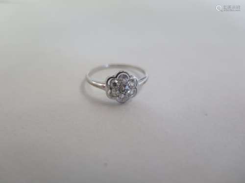 A white metal seven stone diamond ring, size K, approx 1.3 grams, probably platinum some general