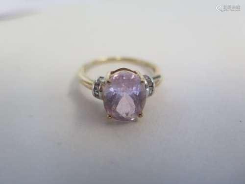 A Gemporia 10ct yellow gold kunzite and white ziron ring, size O, approx 2.7 grams, unworn, with