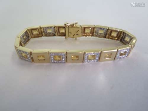 A 14ct yellow gold diamond and yellow stone bracelet, 19cm long, approx 25.9 grams, generally good