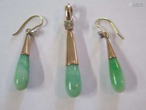 A superb jade and diamond pendant and earrings set, mounted in rose gold, tested as 18ct or or