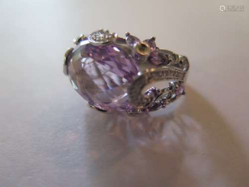 An amethyst and diamond 14ct white gold ring, set with a large oval amethyst, approx 19x14mm, set in