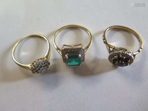 Three 9ct gold dress rings, synthetic emerald and diamond in yellow and white gold setting, size