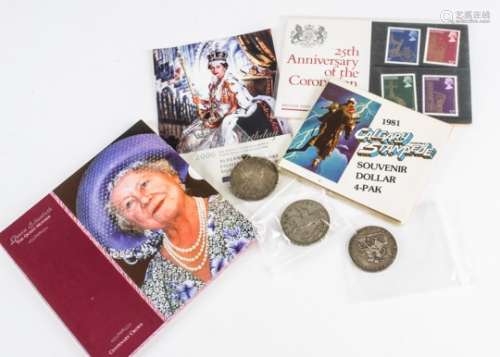 A small collection of coins and stamps, including a George III and Victorian crown, worn, a 1935 and