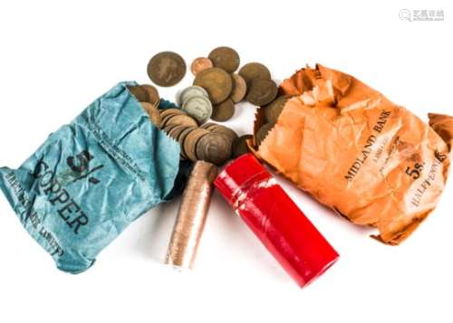 A large collection of British coins, some in red card tubes and plastic, also some in paper bags,