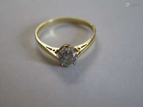 An 18ct yellow gold diamond solitaire ring, set in a white gold mount, the diamond measures 0.