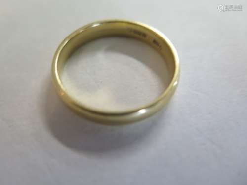 An 18ct yellow gold wedding band, size T, weight 5.4 grams approx, in good condition, light