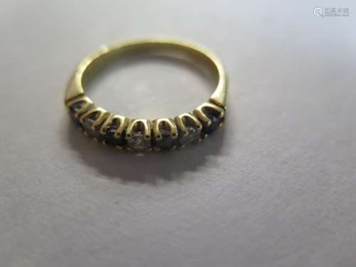 An 18ct gold diamond and sapphire set band or half eternity ring, size S, weight approx 4 grams,