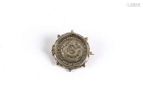A late 19th century Chinese Kwangtung Province 20 cent coin mounted in a silver brooch