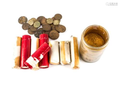 A large collection of British coins, predominantly from the 1960s in red card tubes and paper