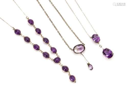 Three amethyst necklaces, comprising two with pairs of oval drops set in silver and another cabochon