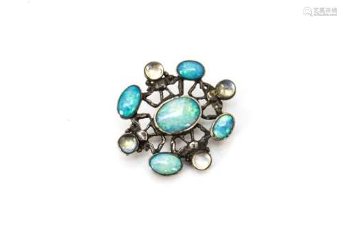 An arts and crafts silver set brooch, set with opals and cabochon paste beads, 4.5cm x 4cm, 10g