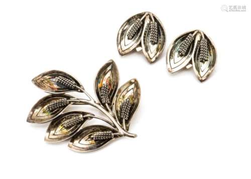 A Danish modernist brooch and earring set, By Raare & Krogh, of leaf design, the earrings with