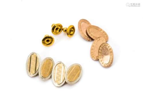 Two pairs of 9ct gold oval linked cufflinks, with engine turned decoration and a set of three gold