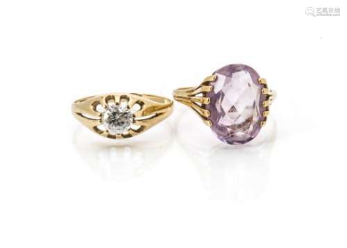 A 9ct gold amethyst dress ring, oval mixed cut centre stone in claw setting, ring size W, and a