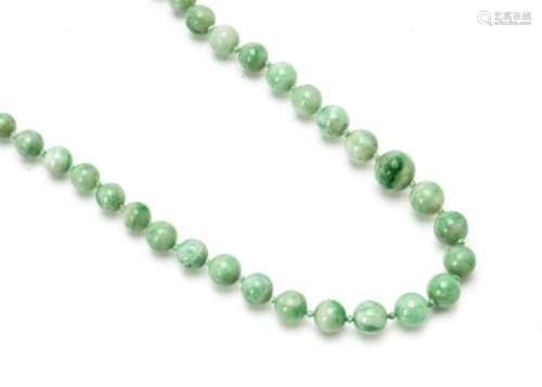 A graduated string of jadeite Jade knotted beads, light green, largest 10.5mm diameter, smallest 4.