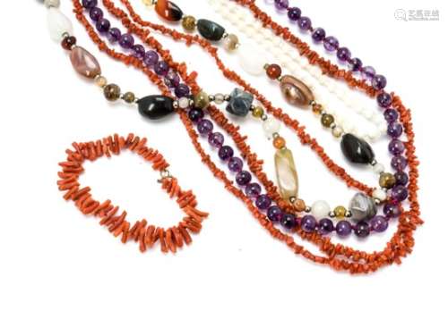 A knotted string of uniform amethyst beads, two coral necklaces, a bracelet example, mother of pearl