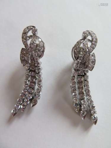A pair of 18ct white gold three row drop earings, each set with 49 brilliant cut diamonds, total