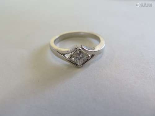 A 950 platinum diamond solitaire ring, the square cut diamond approx 0.60ct, ring size O, approx 9.4