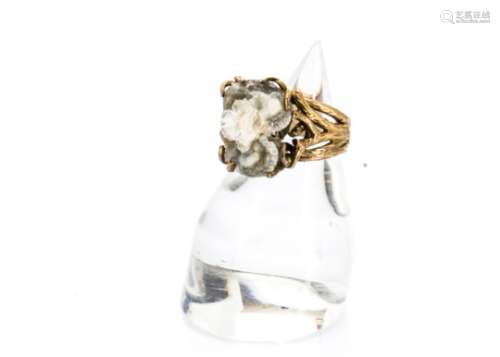 A modernist 9ct gold and rough quartz dress ring, the bark like shank with root styled claw and