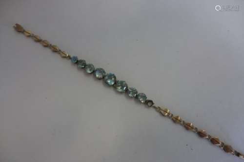 A 9ct gold and blue gem stone bracelet, possibly aquamarine, total weight approx 7.4 grams, not