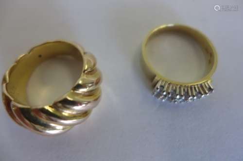 Two 14ct gold rings, one with rope twist decoration, size N, the second set with ten small white