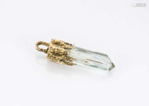 A modernist aquamarine and gold mounted pendant, the light blue semi natural state aquamarine with